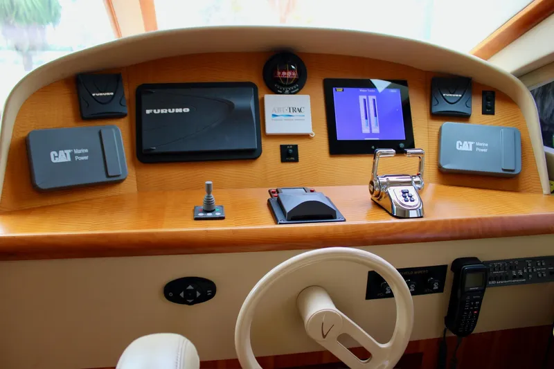 Slide: The Image of Control panel of a 2007 Lazzara 74 Motoryacht with navigation and communication equipment. - 5