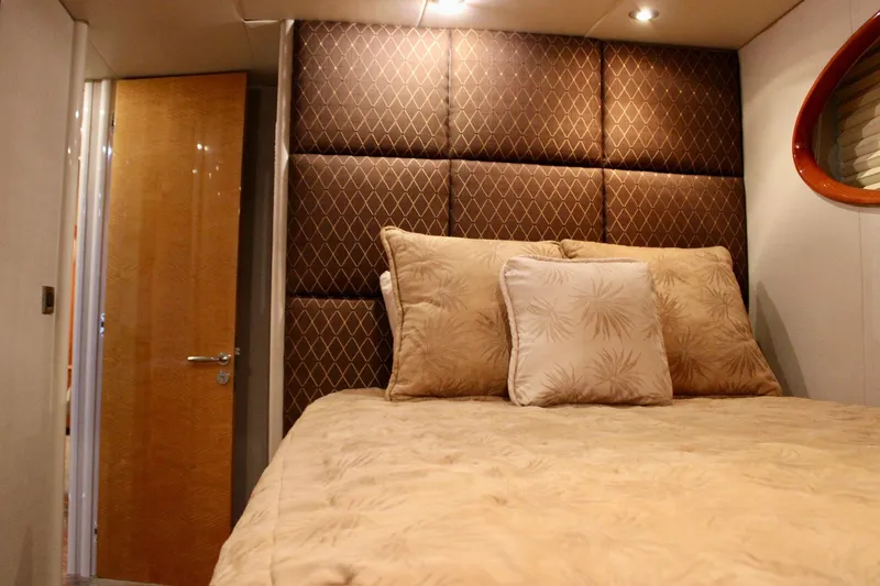 Slide: The Image of Luxurious bedroom interior of 2007 Lazzara 74 Motoryacht with elegant bedding and wood accents. - 53