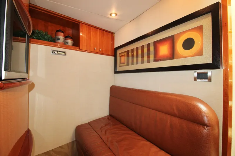 Slide: The Image of Luxurious interior of 2007 Lazzara 74 Motoryacht with modern art and leather seating. - 60