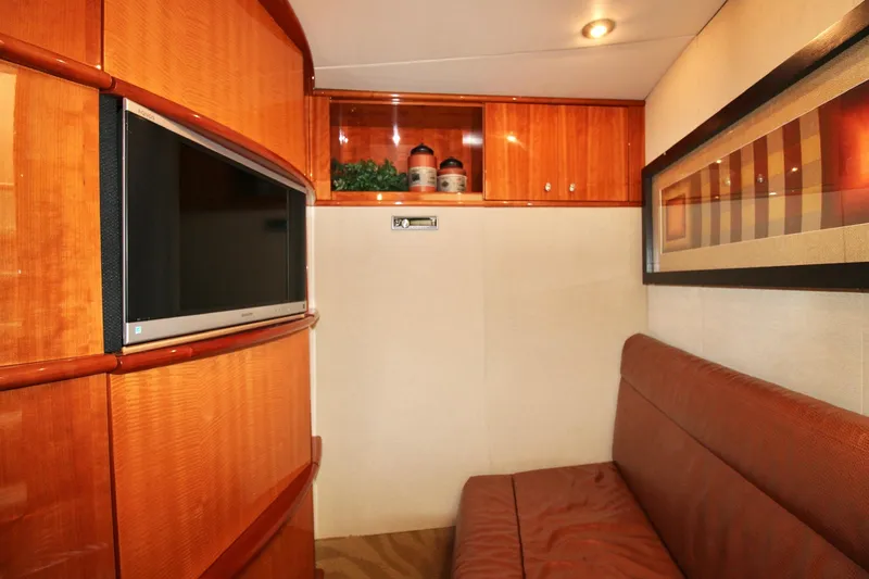 Slide: The Image of Luxurious interior of 2007 Lazzara 74 Motoryacht with TV and elegant wood finishes. - 61