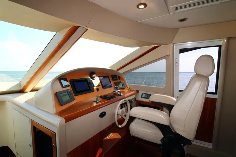 Slide: The Image of Interior helm of 2007 Lazzara 74 Motoryacht with modern navigation equipment and ocean view. - 3