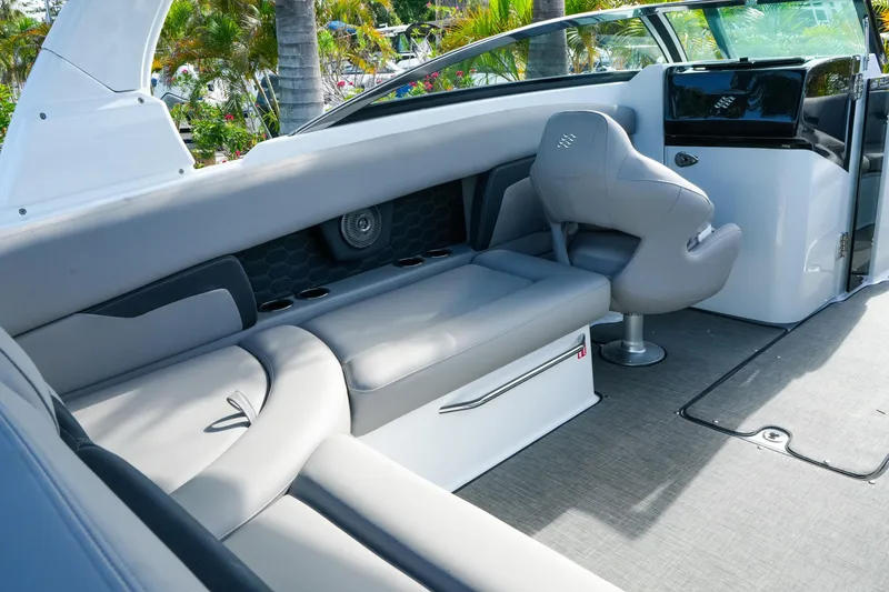 Slide: The Image of Interior of 2027 Four Winns HD8 OB boat with sleek seating and modern design. - 11