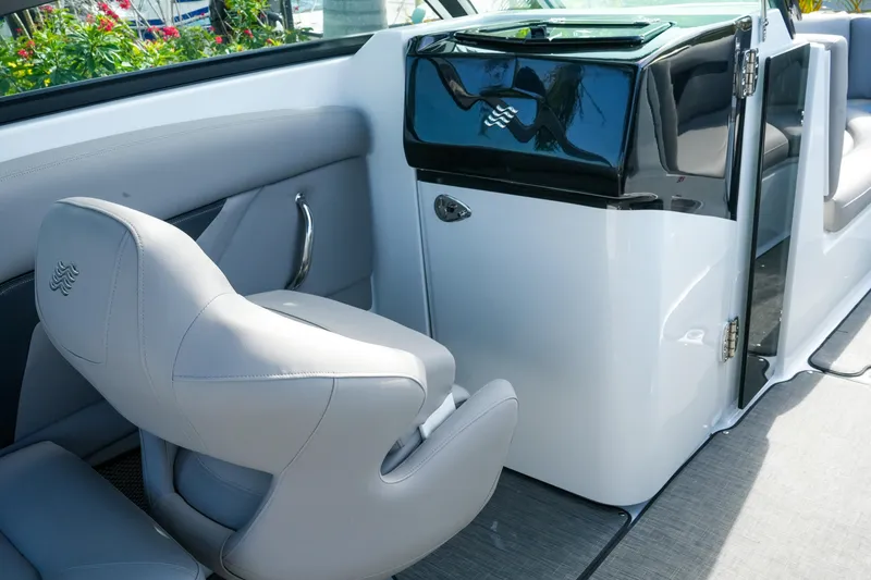 Slide: The Image of Interior of 2027 Four Winns HD8 OB boat with sleek seating and modern design. - 19