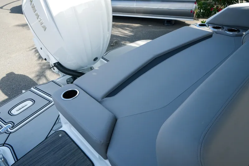 Slide: The Image of 2027 Four Winns HD8 OB boat with Yamaha outboard motor and cushioned seating area. - 37