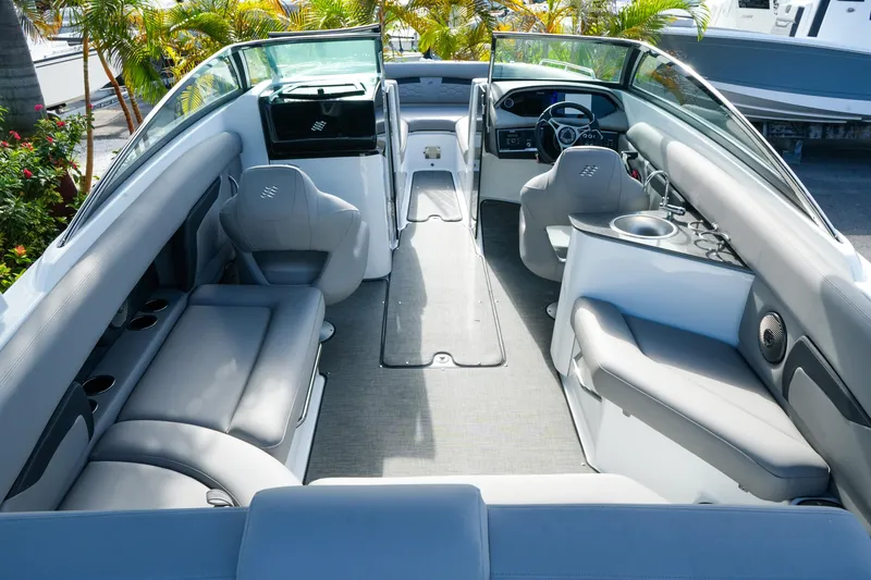 Slide: The Image of Interior of 2027 Four Winns HD8 OB boat with luxurious seating and modern design. - 10