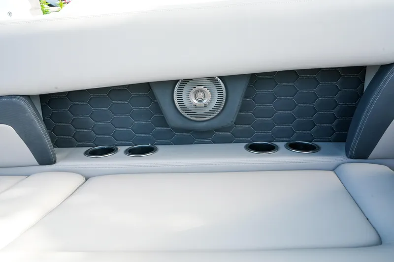 Slide: The Image of 2027 Four Winns HD8 OB boat interior with hexagonal speaker and cup holders. - 20