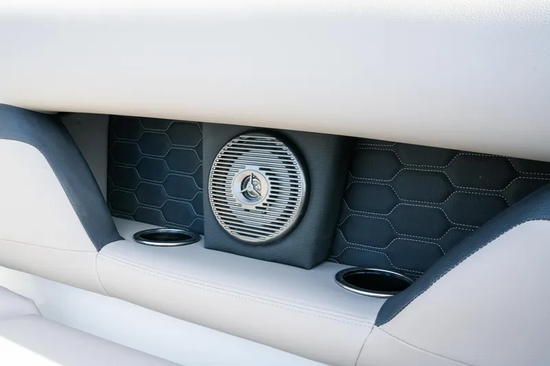 Slide: The Image of Interior of 2027 Four Winns HD8 OB boat with speaker and cup holders. - 27