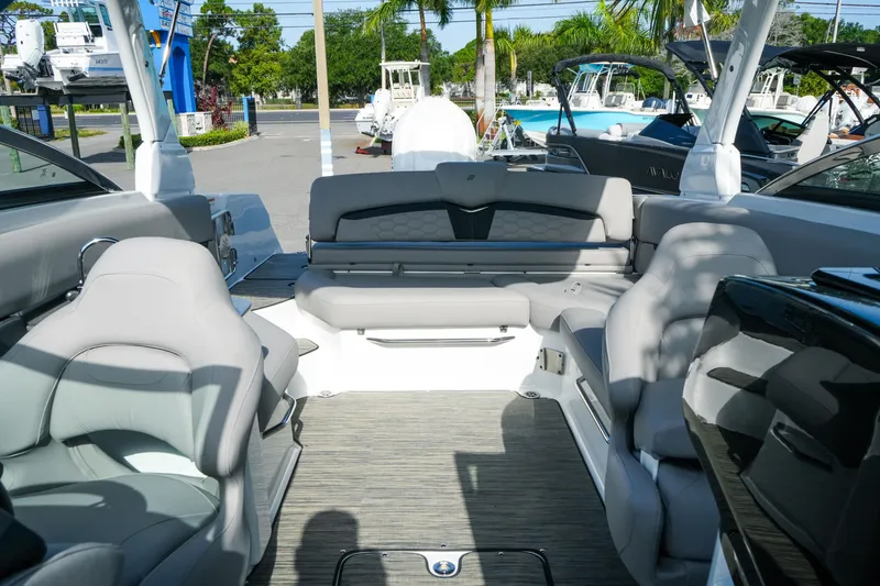 Slide: The Image of Interior of 2027 Four Winns HD8 OB boat with luxurious seating and modern design. - 30