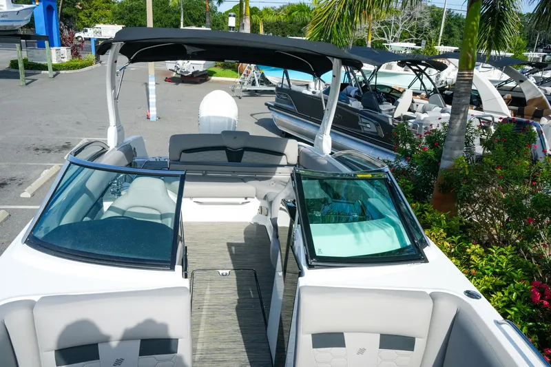 Slide: The Image of 2027 Four Winns HD8 OB boat with sleek design and spacious seating. - 26