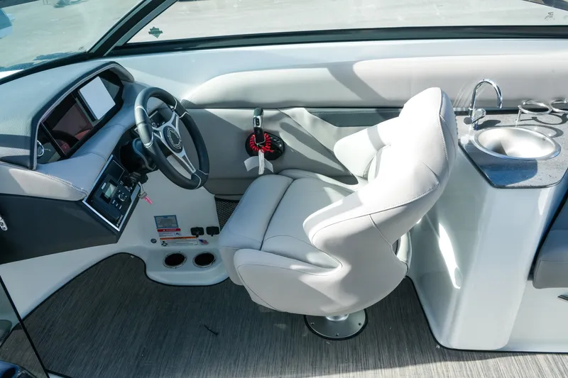 Slide: The Image of Interior of 2027 Four Winns HD8 OB boat with steering wheel and sink. - 32