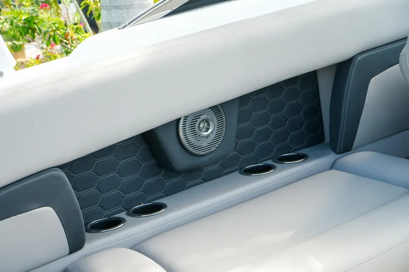 Slide: The Image of Interior of 2027 Four Winns HD8 OB boat with speaker and cup holders. - 12