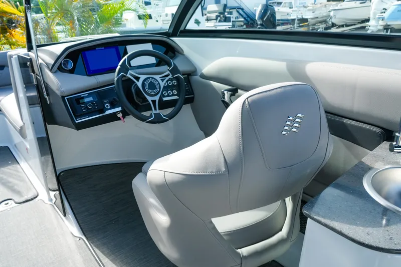 Slide: The Image of Interior of 2027 Four Winns HD8 OB boat with modern steering and dashboard. - 14