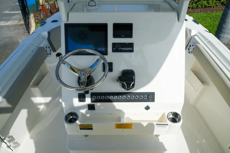 Slide: The Image of Steering console of 2027 Key West 249 FS boat with modern controls and display. - 23