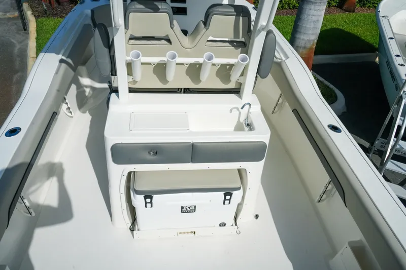 Slide: The Image of 2027 Key West 249 FS boat interior with seating, storage, and fishing rod holders. - 17