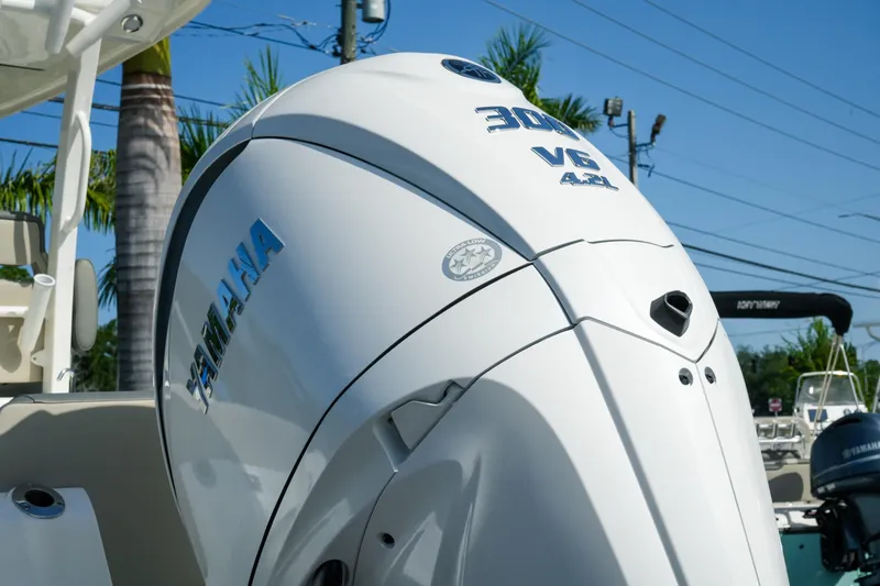 Slide: The Image of Yamaha 300 V6 4.2L engine on 2027 Key West 249 FS boat, sunny day. - 12