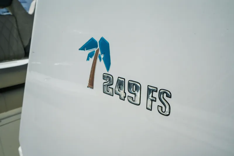 Slide: The Image of 2027 Key West 249 FS boat logo on white surface. - 42