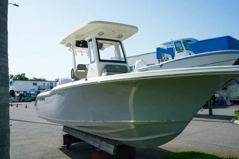 Slide: The Image of 2027 Key West 249 FS boat displayed outdoors on a sunny day. - 5