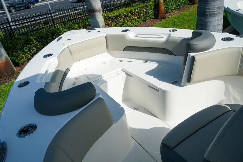 Slide: The Image of 2027 Key West 249 FS boat interior with cushioned seating and cup holders. - 30