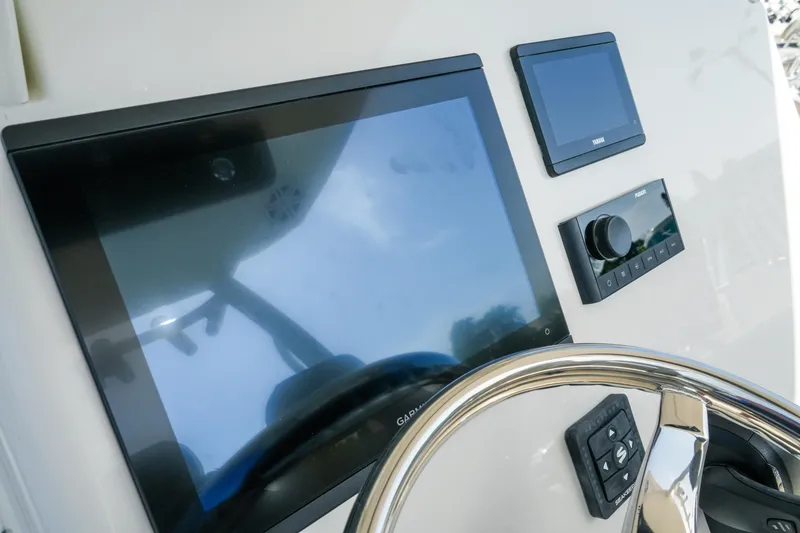 Slide: The Image of Dashboard of 2027 Key West 249 FS boat with modern navigation screens. - 27