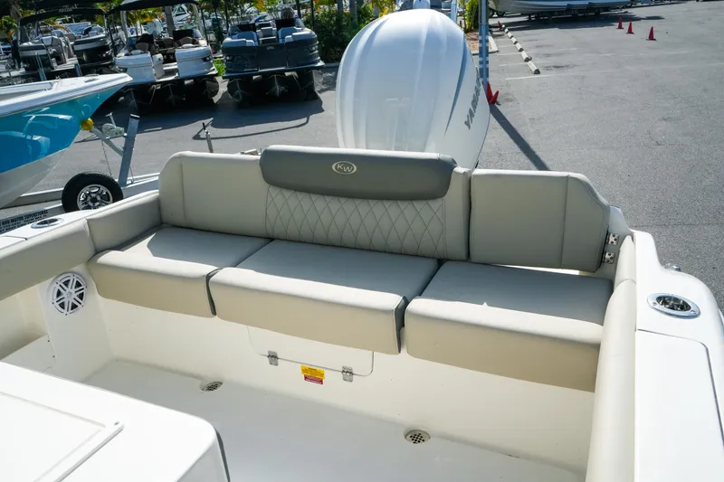 Slide: The Image of 2027 Key West 249 FS boat interior with cushioned seating and Yamaha engine. - 47