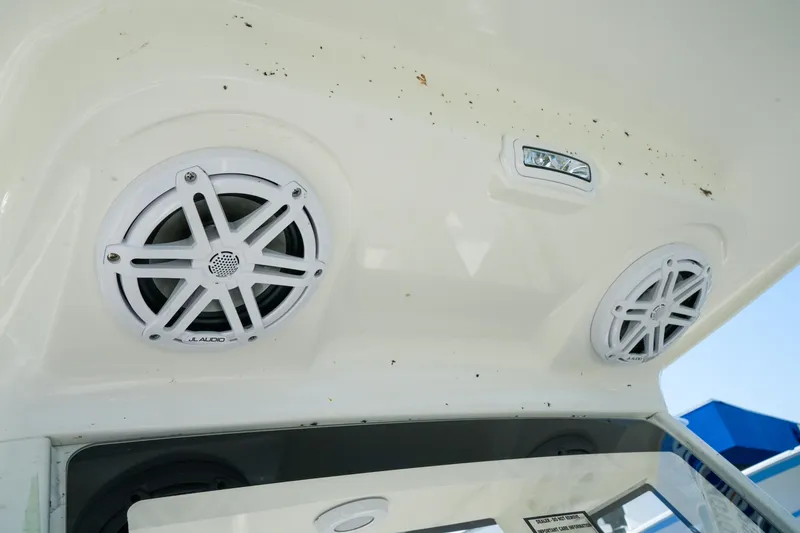 Slide: The Image of 2027 Key West 249 FS boat speakers and light on white interior ceiling. - 40