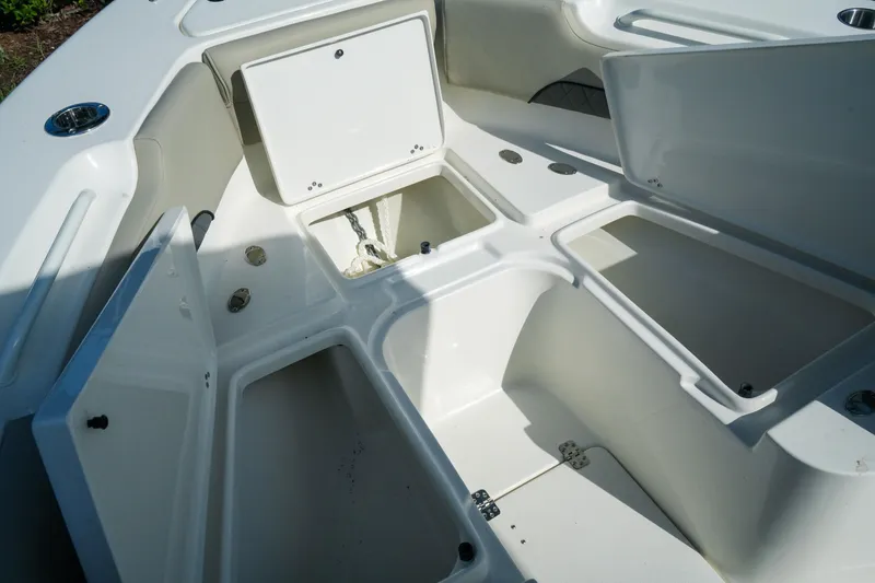 Slide: The Image of 2027 Key West 249 FS boat interior storage compartments open, showcasing spacious design. - 32