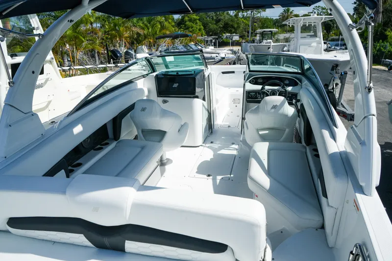 Slide: The Image of 2026 Four Winns HD8 OB boat interior with white seating and modern dashboard. - 7