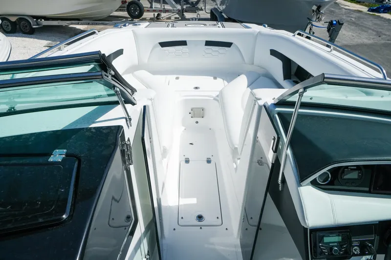 Slide: The Image of 2026 Four Winns HD8 OB boat interior with sleek white seating and modern dashboard design. - 15