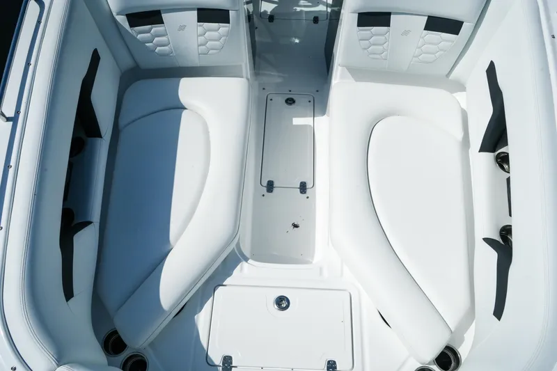 Slide: The Image of Interior seating of 2026 Four Winns HD8 OB boat, featuring white cushioned seats. - 18
