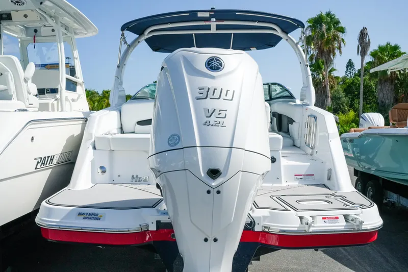 Slide: The Image of 2026 Four Winns HD8 OB boat with Yamaha 300 V6 engine, docked under sunny skies. - 3