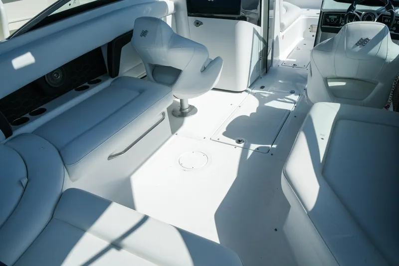 Slide: The Image of Interior of 2026 Four Winns HD8 OB boat with white seating and modern design. - 11