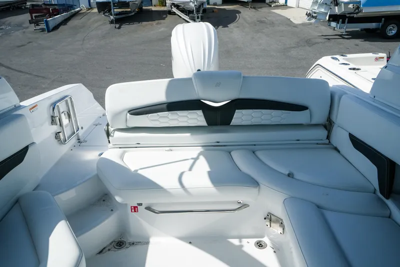 Slide: The Image of 2026 Four Winns HD8 OB boat interior with white seating and sleek design. - 25