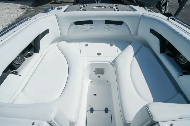 Slide: The Image of 2026 Four Winns HD8 OB boat interior with white seating and cup holders. - 16