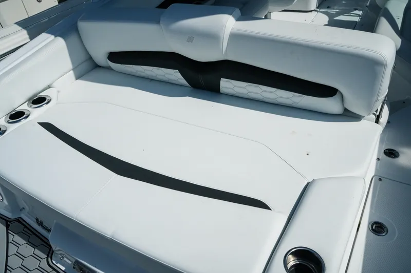 Slide: The Image of 2026 Four Winns HD8 OB boat with sleek white seating and cup holders. - 6