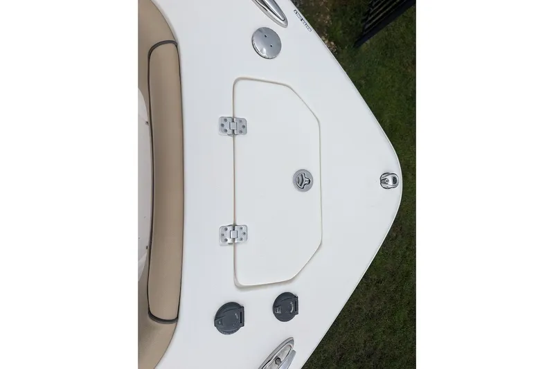 Slide: The Image of 2020 NauticStar 2602 Legacy boat deck with storage hatch and fittings. - 14