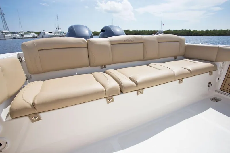 Slide: The Image of Manufacturer Provided Image: 2020 NauticStar 2602 Legacy boat with tan cushioned seating. - 29