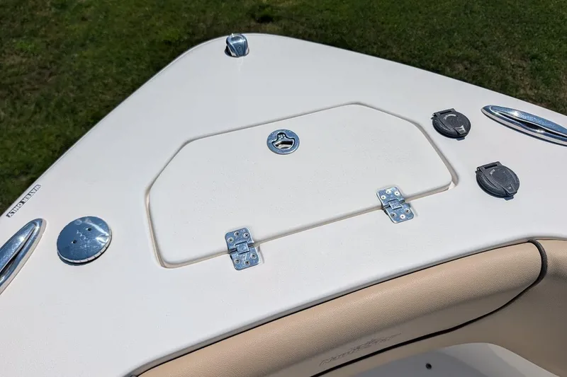 Slide: The Image of 2020 NauticStar 2602 Legacy boat deck with storage hatch and fittings. - 30