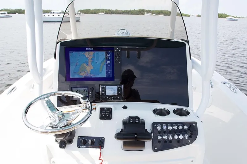 Slide: The Image of Manufacturer Provided Image: 2020 NauticStar 2602 Legacy boat dashboard with navigation system and controls. - 24