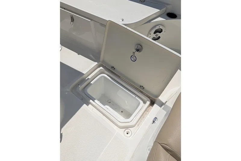 Slide: The Image of Open storage compartment on 2020 NauticStar 2602 Legacy boat deck. - 26
