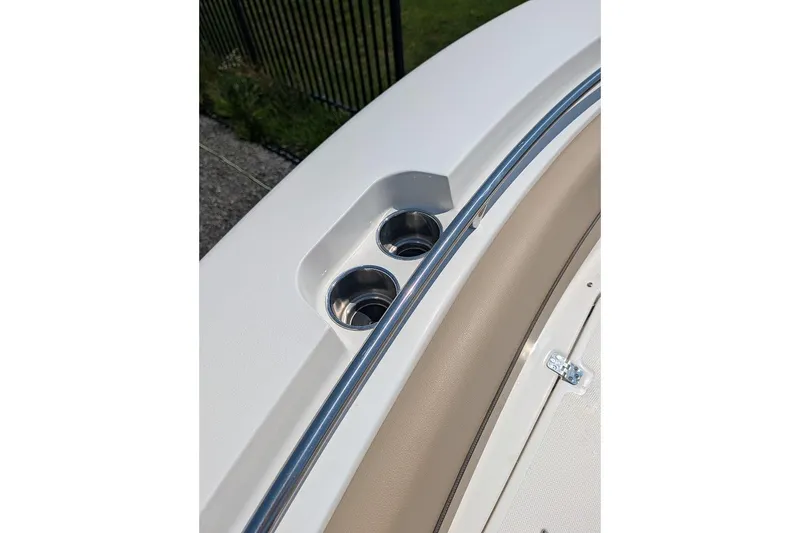 Slide: The Image of 2020 NauticStar 2602 Legacy boat detail with cup holders and railing. - 29