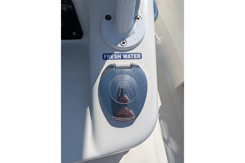 Slide: The Image of Freshwater shower control on 2020 NauticStar 2602 Legacy boat deck. - 8