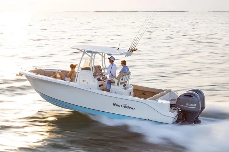 Slide: The Image of Manufacturer Provided Image: 2020 NauticStar 2602 Legacy boat cruising on open water. - 18