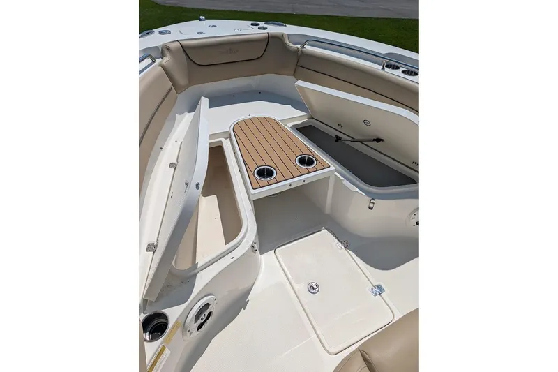 Slide: The Image of 2020 NauticStar 2602 Legacy boat interior with storage compartments and seating. - 25