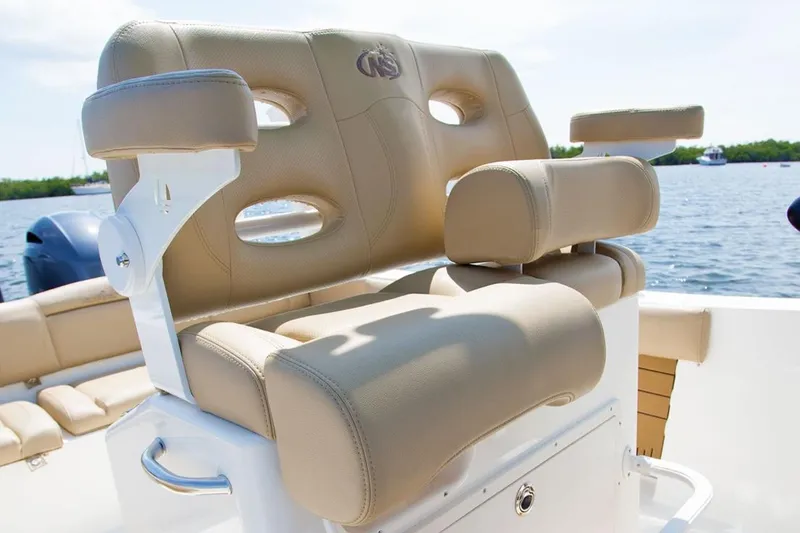 Slide: The Image of Manufacturer Provided Image: 2020 NauticStar 2602 Legacy boat seating with beige upholstery. - 25