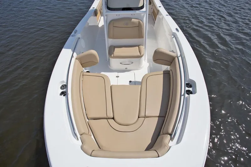 Slide: The Image of Manufacturer Provided Image: 2020 NauticStar 2602 Legacy boat with tan seating on water. - 23