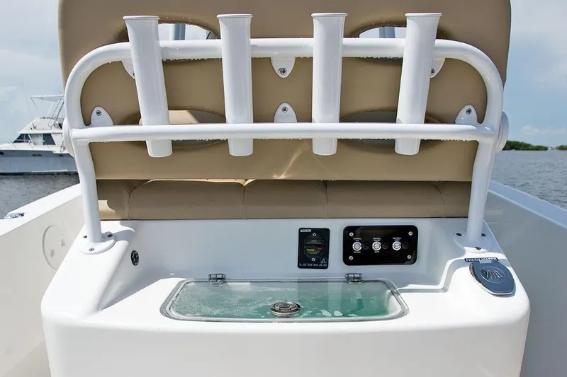 Slide: The Image of Manufacturer Provided Image: 2020 NauticStar 2602 Legacy boat console with rod holders and control panel. - 28