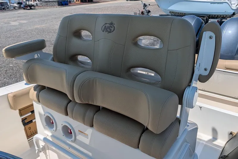 Slide: The Image of 2020 NauticStar 2602 Legacy boat seating with armrests and logo detailing. - 15