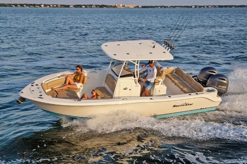Slide: The Image of Manufacturer Provided Image: 2020 NauticStar 2602 Legacy boat cruising on the water with passengers. - 19
