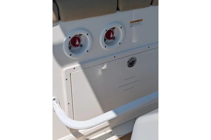 Slide: The Image of 2020 NauticStar 2602 Legacy boat interior with control panel and switches. - 16