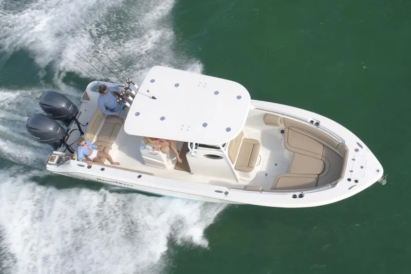 Slide: The Image of Manufacturer Provided Image: 2020 NauticStar 2602 Legacy boat cruising on water. - 22